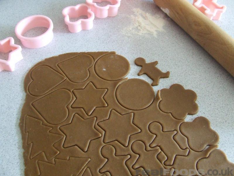 cutting out gingerbread decorations